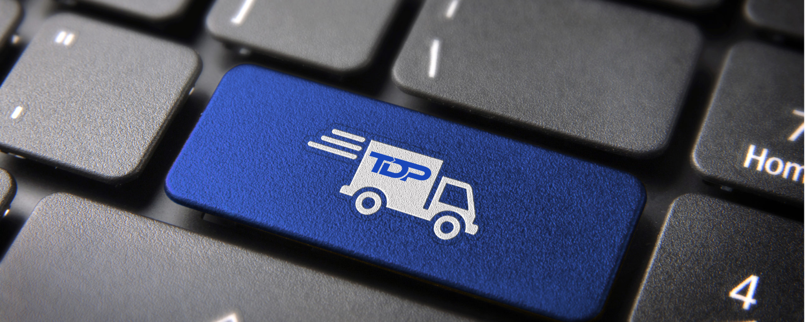 TDP Transport delivery key with truck icon on laptop keyboard. Included clipping path, so you can easily edit it.
